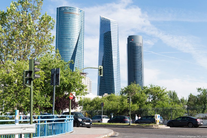 20160605_190501 D4S.jpg - The center building  is  Torre de Cristal (Tower of Glass) the tallest building in Spain.  Built 2008.  One of 4 buildings in the Tower Center Business Complex.  The building on right is PwC Building.  It is 58 stories high. 31 of which is a hotel (Hotel Eurostar). Building on left is Torre Espacio (Space Tower) and is 57 stories.